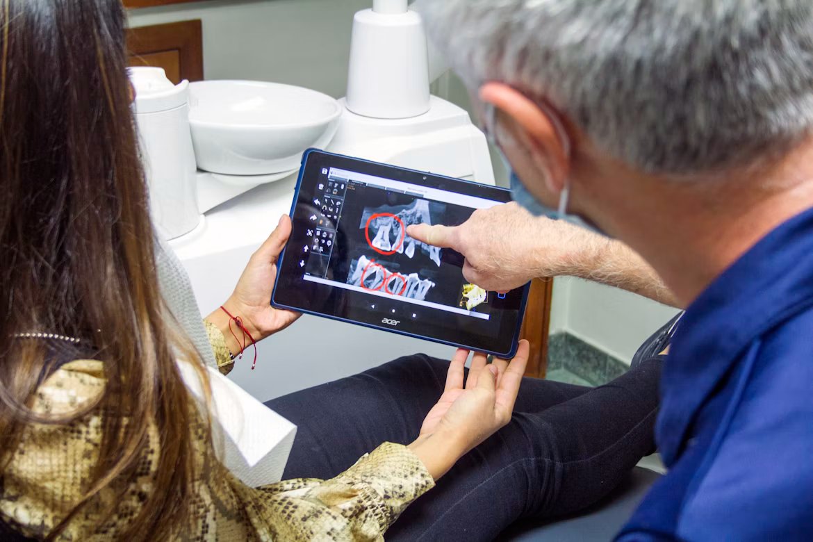 Dentist reviewing digital patient records